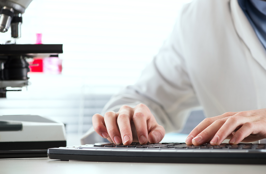 Laboratory research scientist analyzing diagnostic specimens
